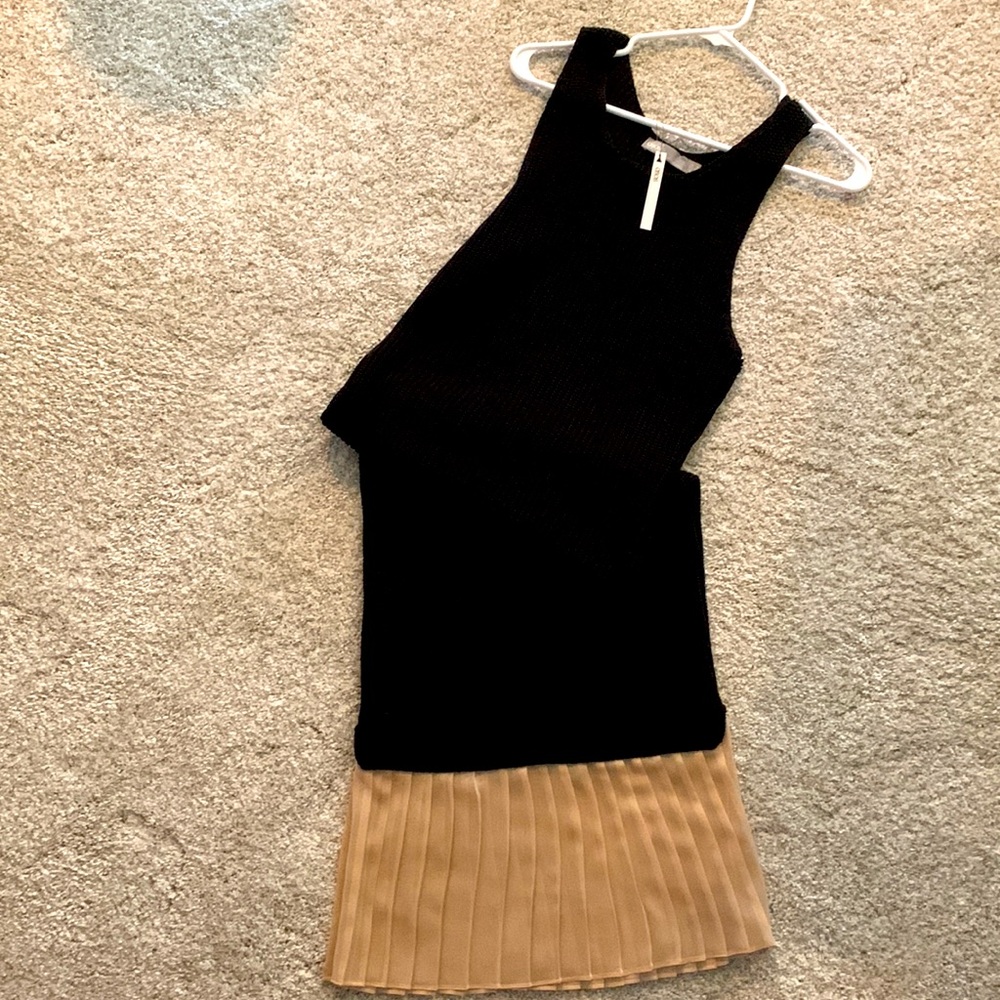 ankle length black knit dress, 100% acrylic bottom pleated trim 100% polyester